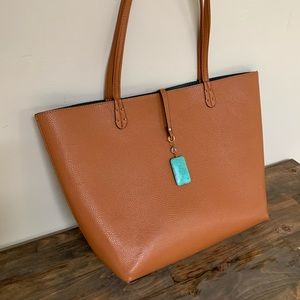 Brown faux leather tote. One large open bag.